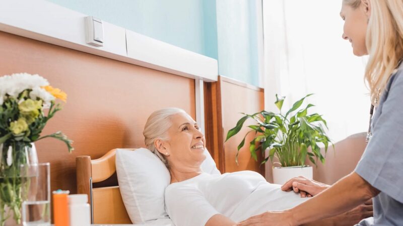 A nurse is examining her patient